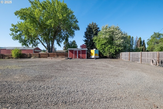 31501 Stoltz Hill Rd, Lebanon, OR 97355 - fenced backyard with a storage unit and an outbuilding