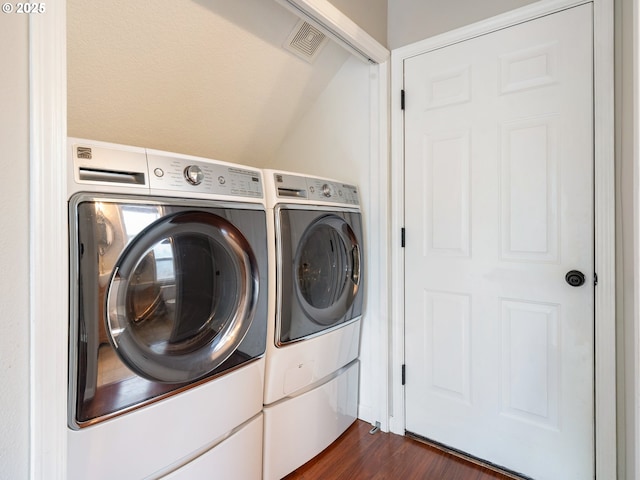 42019 NW Oak Way, Banks, OR 97106 - laundry room with washing machine and dryer and dark wood finished floors