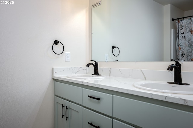 bathroom with a sink and double vanity