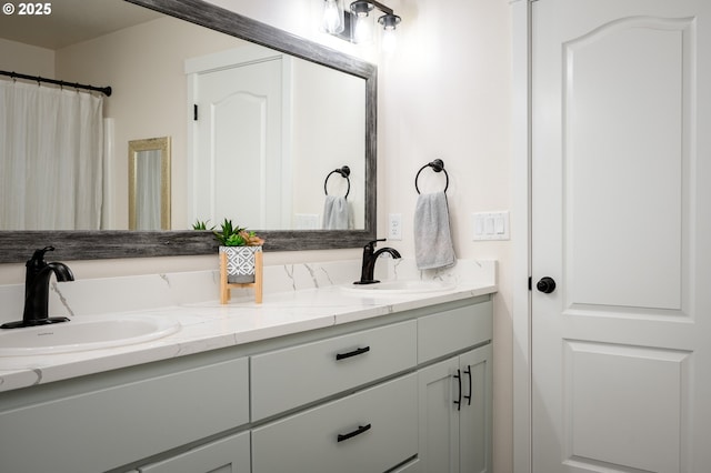 bathroom with double vanity and a sink