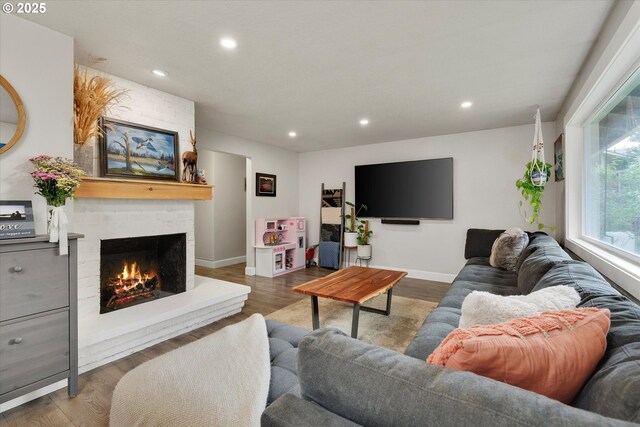 7353 SE Thiessen Rd, Milwaukie, OR 97267 - living area featuring recessed lighting, a large fireplace, and wood finished floors