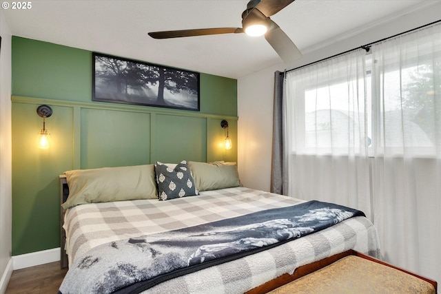 7353 SE Thiessen Rd, Milwaukie, OR 97267 - bedroom with wood finished floors, a decorative wall, and ceiling fan