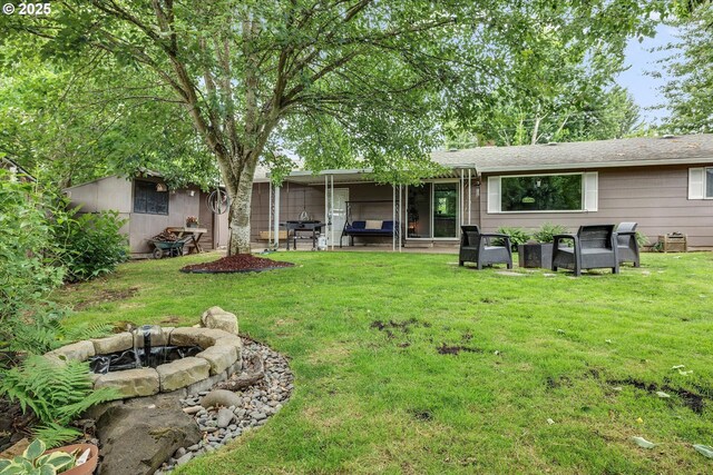7353 SE Thiessen Rd, Milwaukie, OR 97267 - rear view of property with a patio, a lawn, an exterior structure, and an outbuilding
