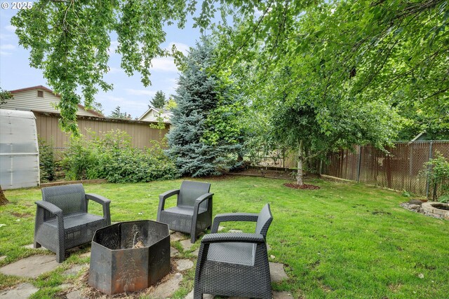 7353 SE Thiessen Rd, Milwaukie, OR 97267 - fenced backyard with an outdoor fire pit