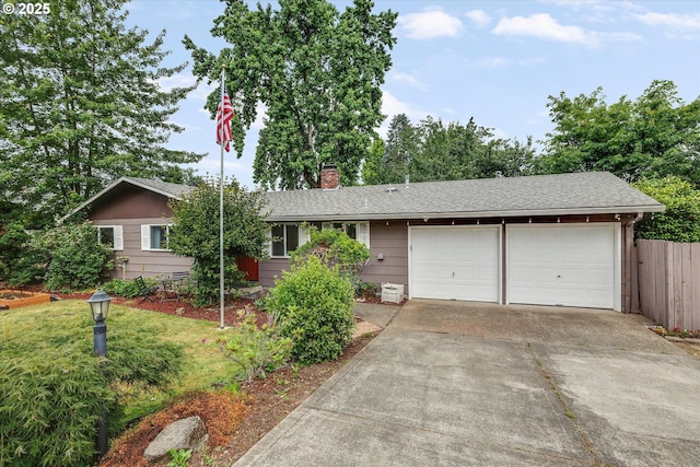 7353 SE Thiessen Rd, Milwaukie, OR 97267 - ranch-style house with a garage, driveway, a chimney, and a shingled roof