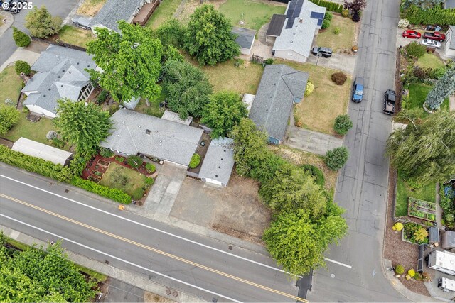 7353 SE Thiessen Rd, Milwaukie, OR 97267 - ranch-style home featuring a garage, driveway, a chimney, and roof with shingles