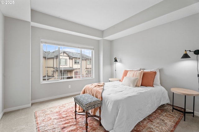 carpeted bedroom with baseboards