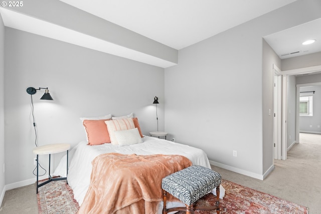 bedroom with carpet flooring, visible vents, and baseboards