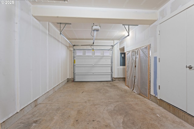 garage with electric panel and a garage door opener