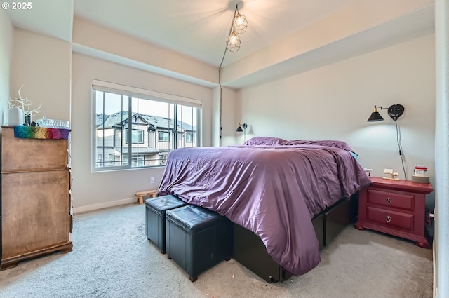 bedroom featuring light colored carpet