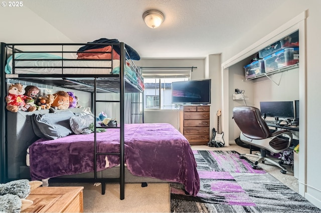 carpeted bedroom with a textured ceiling