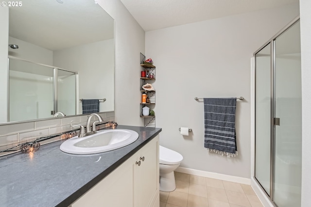 bathroom with toilet, tile patterned flooring, decorative backsplash, an enclosed shower, and vanity