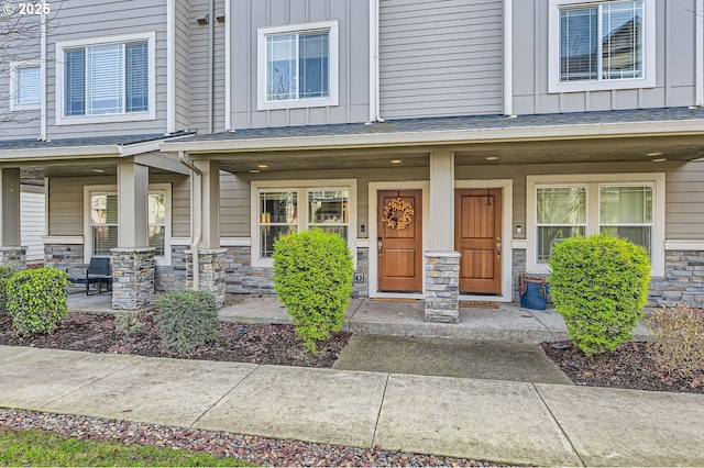 view of exterior entry featuring a porch