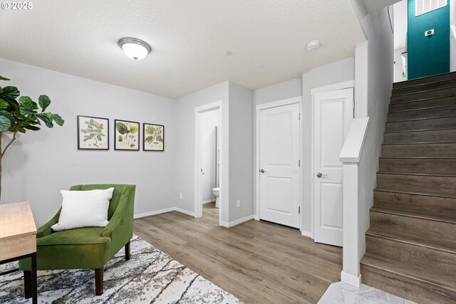 sitting room with a textured ceiling