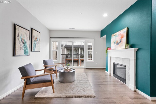 living room with light hardwood / wood-style flooring