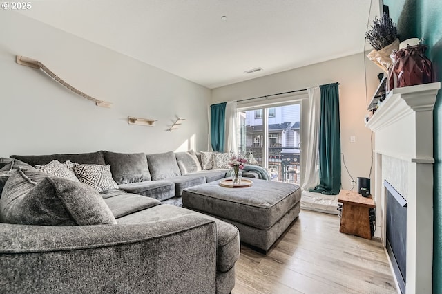 living room with light hardwood / wood-style flooring