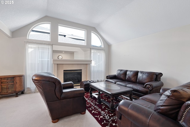 1545 NE Gertz Rd, Portland, OR 97211 - living room featuring lofted ceiling, carpet floors, a glass covered fireplace, and a textured ceiling