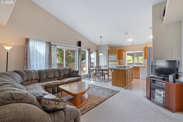 1545 NE Gertz Rd, Portland, OR 97211 - living room featuring light carpet, recessed lighting, and high vaulted ceiling