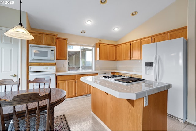 1545 NE Gertz Rd, Portland, OR 97211 - kitchen featuring white appliances, tile counters, a kitchen island, vaulted ceiling, and light flooring