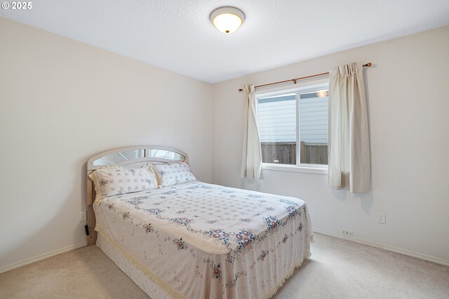 1545 NE Gertz Rd, Portland, OR 97211 - bedroom with carpet and baseboards