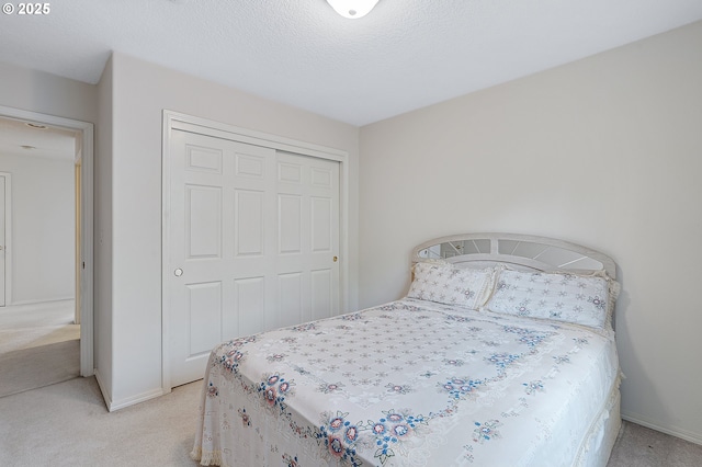 1545 NE Gertz Rd, Portland, OR 97211 - bedroom with light carpet, a closet, and baseboards