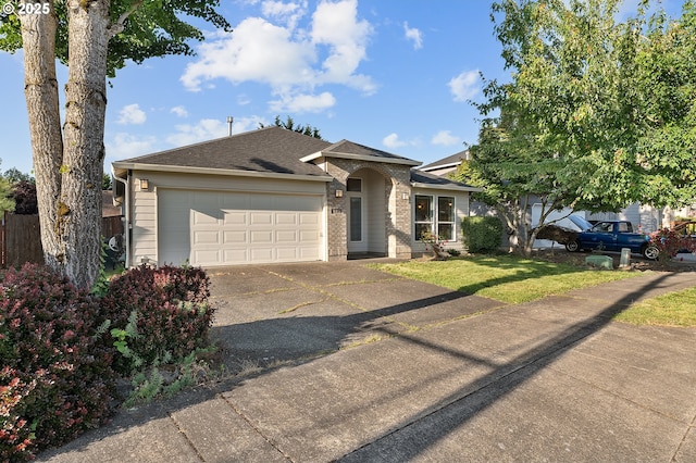 1545 NE Gertz Rd, Portland, OR 97211 - single story home featuring driveway, an attached garage, roof with shingles, a front yard, and brick siding