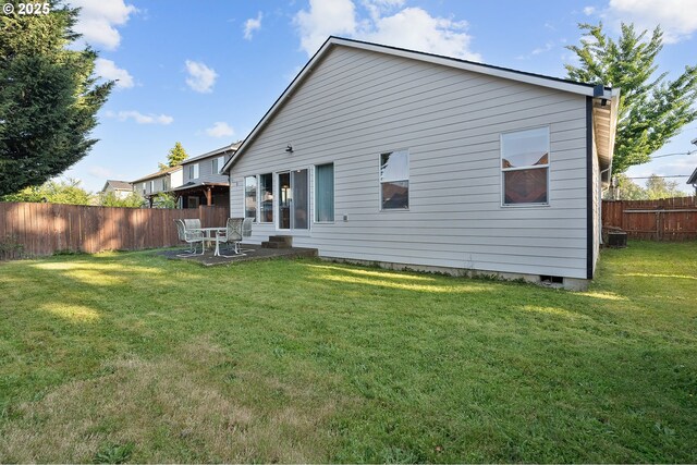 1545 NE Gertz Rd, Portland, OR 97211 - back of property featuring a patio area and central AC unit