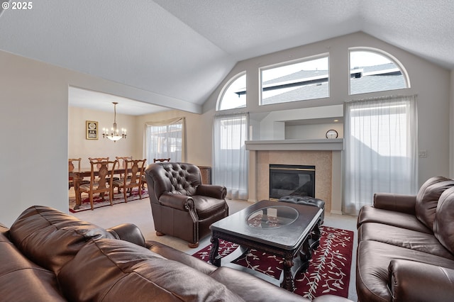 1545 NE Gertz Rd, Portland, OR 97211 - living area featuring carpet, a chandelier, a glass covered fireplace, a textured ceiling, and high vaulted ceiling
