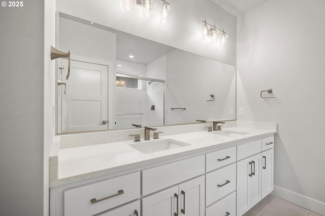 bathroom with tile patterned flooring, vanity, and a shower with door