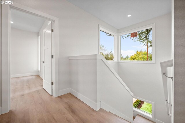 hall with light hardwood / wood-style flooring