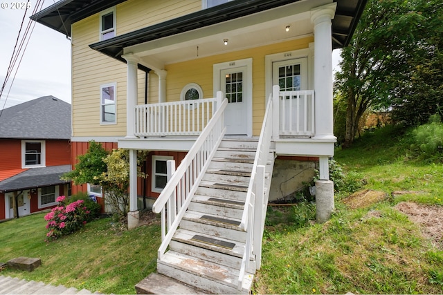 640 8th St, Astoria, OR 97103 - view of exterior entry with a porch and a lawn