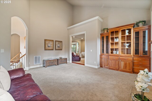 14079 SE Alta Vista Dr, Happy Valley, OR 97086 - carpeted living area featuring high vaulted ceiling, arched walkways, visible vents, recessed lighting, and baseboards