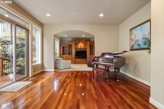 14079 SE Alta Vista Dr, Happy Valley, OR 97086 - living area with baseboards, recessed lighting, arched walkways, and wood finished floors