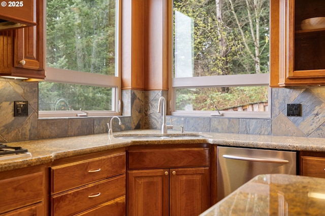 14079 SE Alta Vista Dr, Happy Valley, OR 97086 - kitchen with light stone countertops, stainless steel dishwasher, a sink, and plenty of natural light