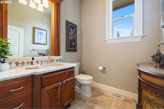 14079 SE Alta Vista Dr, Happy Valley, OR 97086 - half bath with visible vents, baseboards, toilet, vanity, and backsplash