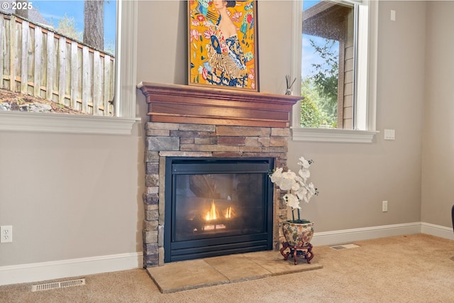 14079 SE Alta Vista Dr, Happy Valley, OR 97086 - interior details with a fireplace, carpet, visible vents, and baseboards