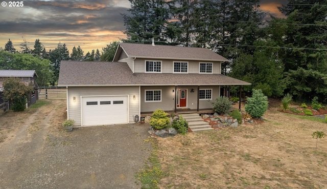 87951 Blazer Ln, Bandon, OR 97411 - view of front of property with a garage, driveway, and a shingled roof