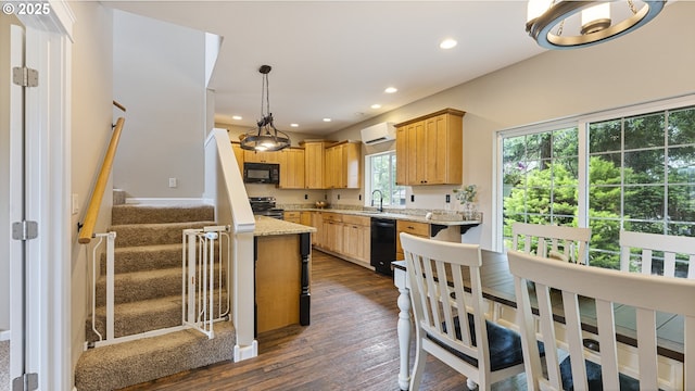87951 Blazer Ln, Bandon, OR 97411 - kitchen featuring black appliances, a wall mounted AC, dark wood-type flooring, light brown cabinets, and recessed lighting