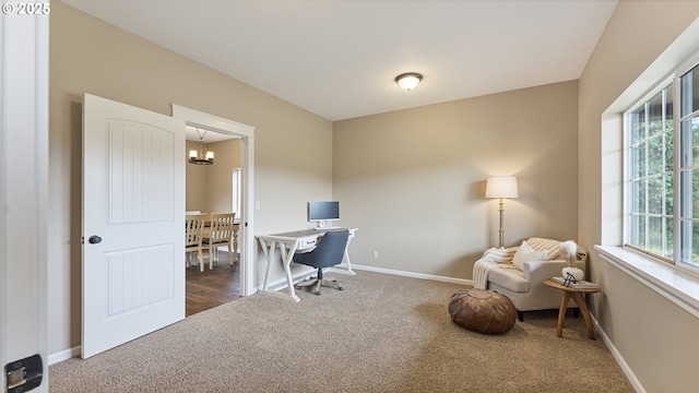 87951 Blazer Ln, Bandon, OR 97411 - carpeted office with healthy amount of natural light and a chandelier