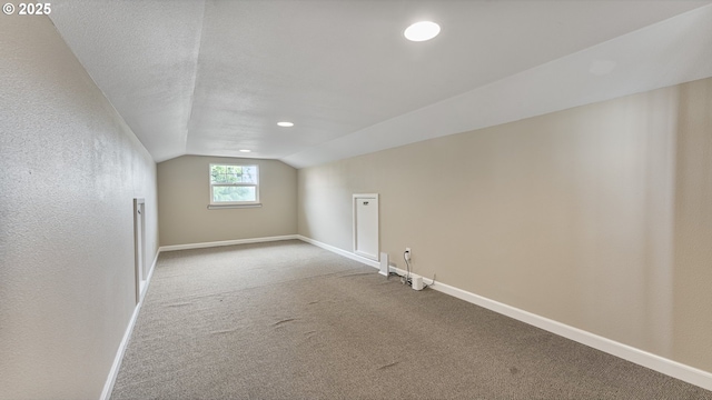 87951 Blazer Ln, Bandon, OR 97411 - additional living space with vaulted ceiling, carpet floors, and recessed lighting