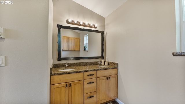 87951 Blazer Ln, Bandon, OR 97411 - bathroom featuring vaulted ceiling and double vanity