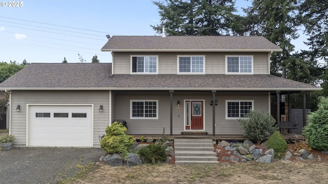 87951 Blazer Ln, Bandon, OR 97411 - view of front of house with an attached garage, a shingled roof, a porch, and asphalt driveway