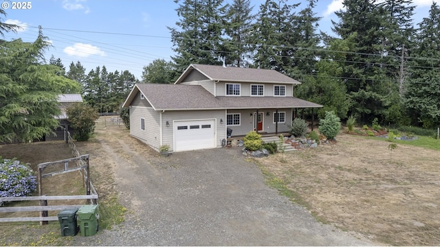 87951 Blazer Ln, Bandon, OR 97411 - view of front facade featuring driveway, an attached garage, and a porch