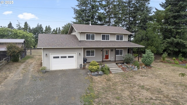 87951 Blazer Ln, Bandon, OR 97411 - view of front of property featuring a garage, driveway, covered porch, and a shingled roof