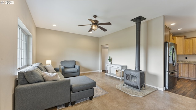 87951 Blazer Ln, Bandon, OR 97411 - living area with ceiling fan, a wood stove, and recessed lighting