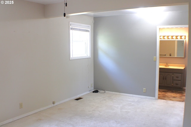 131 Mountain View Ave, Myrtle Creek, OR 97457 - carpeted empty room featuring a sink and baseboards