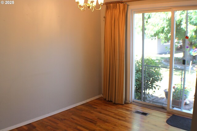 131 Mountain View Ave, Myrtle Creek, OR 97457 - spare room featuring a chandelier and wood finished floors