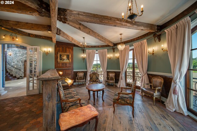 26480 SW Wilken Ln, West Linn, OR 97068 - living area featuring a chandelier, beam ceiling, and wainscoting