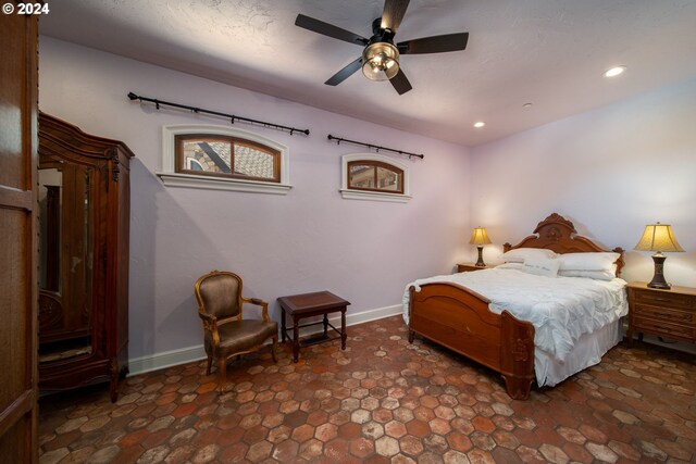 26480 SW Wilken Ln, West Linn, OR 97068 - bedroom featuring stone finish floors, recessed lighting, baseboards, and ceiling fan