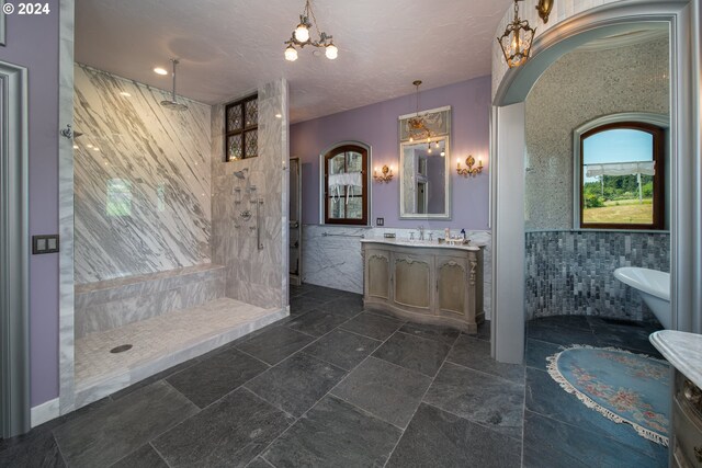 26480 SW Wilken Ln, West Linn, OR 97068 - bathroom with vanity, a chandelier, walk in shower, and tile walls